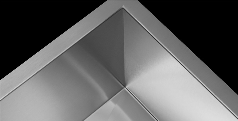 Non-through welded sink corner